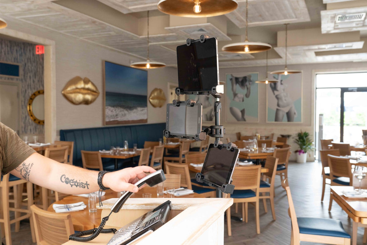 iBOLT device mounting setup in a restaurant workspace