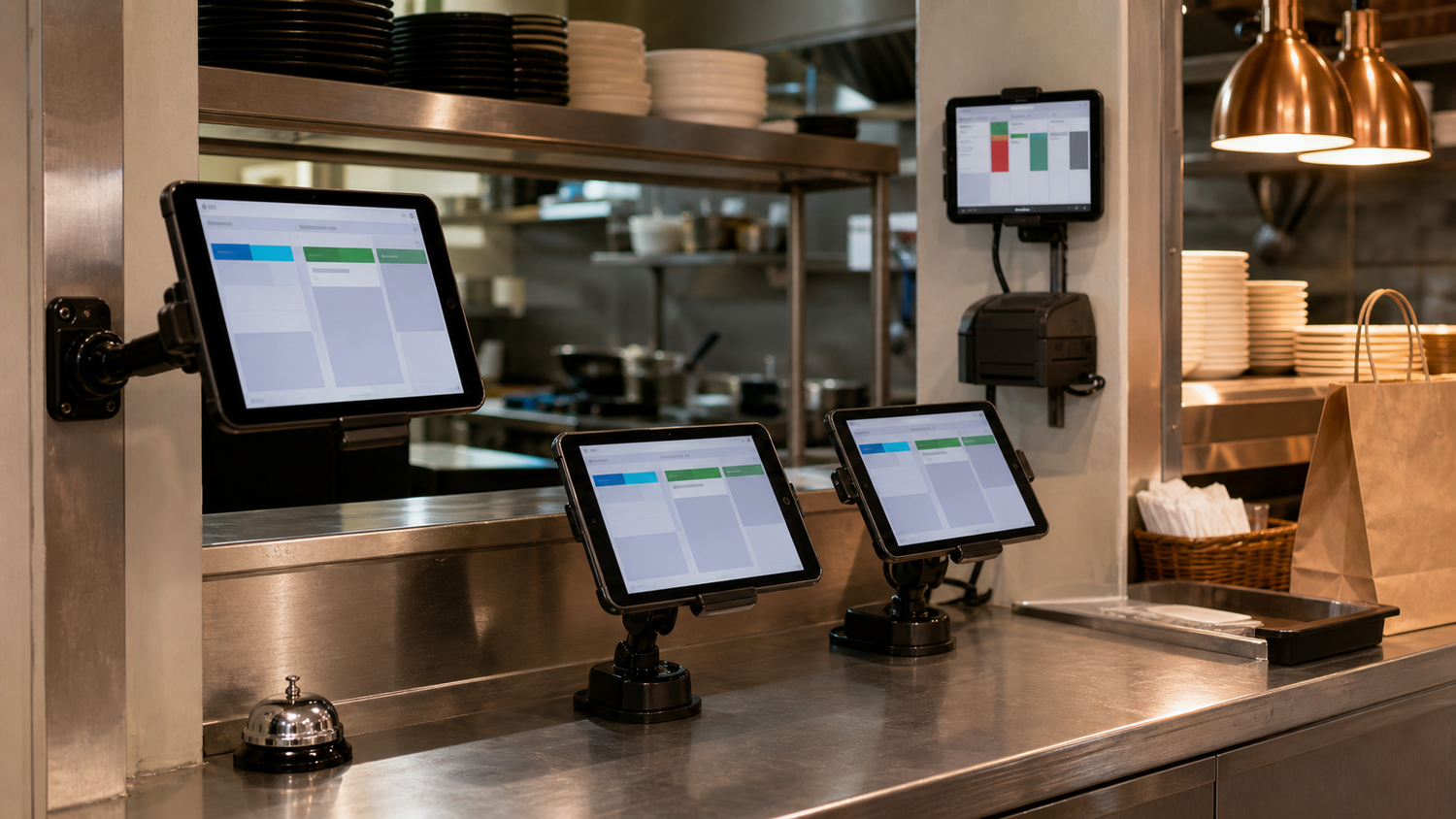 Mounted restaurant tablets at a counter and expo station