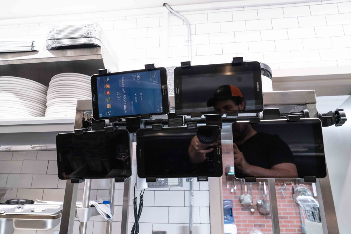 iBOLT device mounting setup in a restaurant workspace