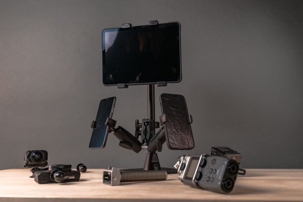 iBOLT studio photograph showing cameras and screens around an adjustable mounting stand